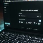 Laptop screen showing a search bar.